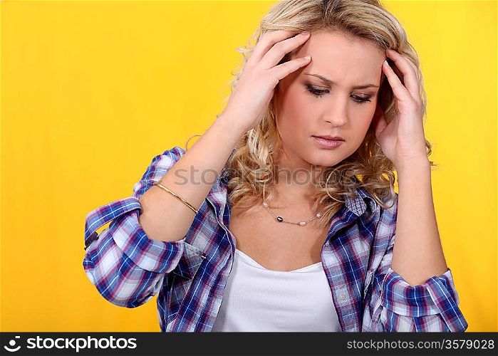 Young woman suffering from a headache
