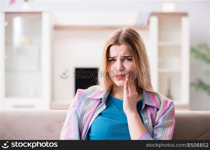 Young woman suffering with pain at home