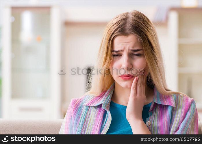 Young woman suffering with pain at home