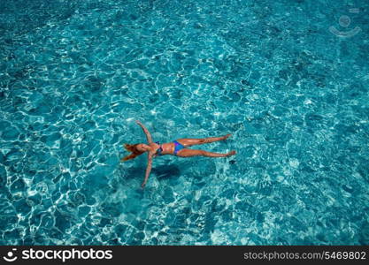 Young woman swiming in sea