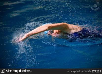 Young woman swimmer in pool