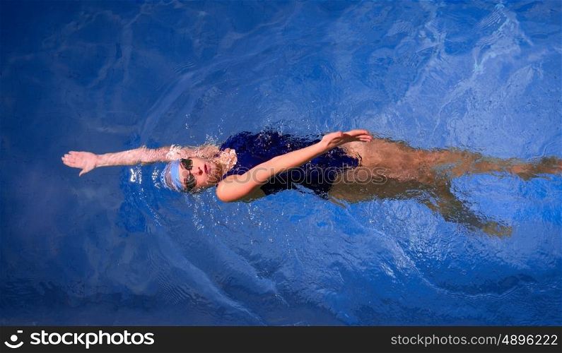 Young woman swimmer in swimming pool