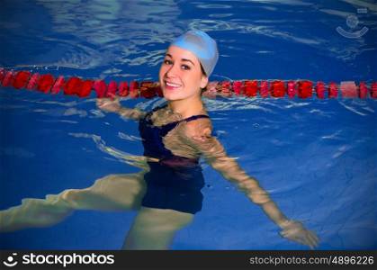 Young woman swimmer in swimming pool