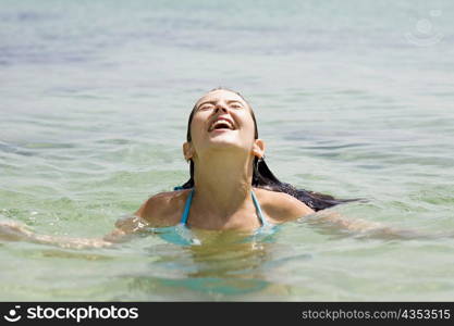 Young woman swimming in the sea