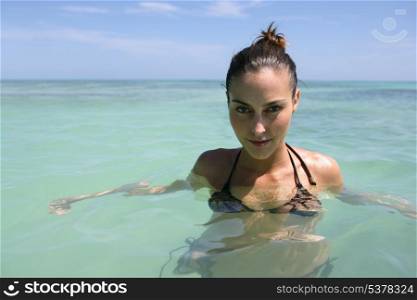 young woman swimming in the sea