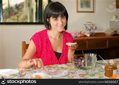 Young woman taking a breakfast at home