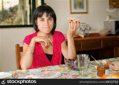Young woman taking a breakfast at home