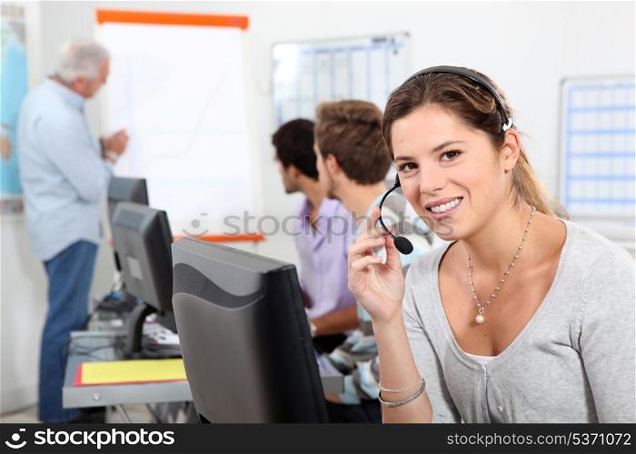 Young woman taking a business call on a headset