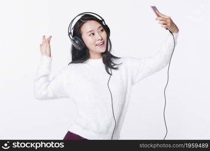 Young woman taking a selfie with her mobile phone