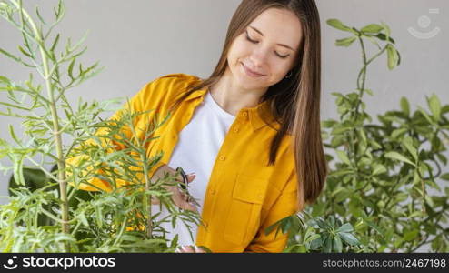young woman taking care green plants 5