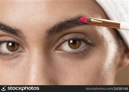 young woman taking care her eyebrows 2