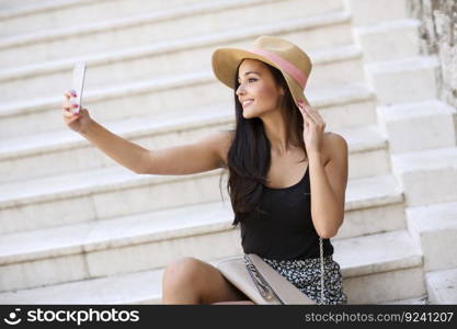 Young woman taking selfie outdoor