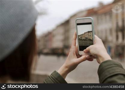 young woman taking with her phone