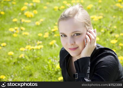 Young Woman Talking By Cell Phone