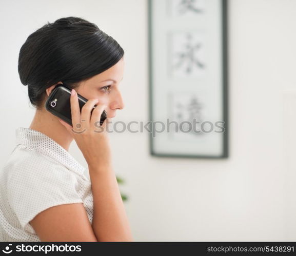 Young woman talking mobile phone