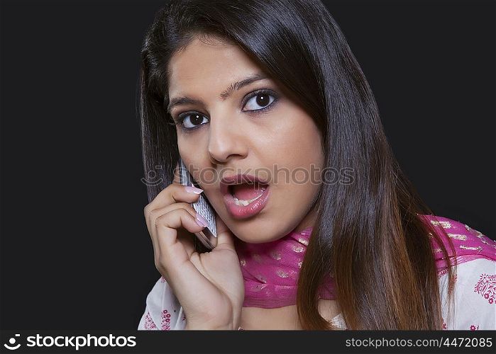 Young woman talking on her mobile phone