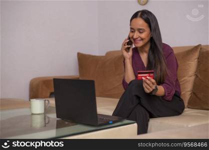 Young woman talking on Smartphone during online shopping 