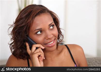 Young woman talking on the telephone