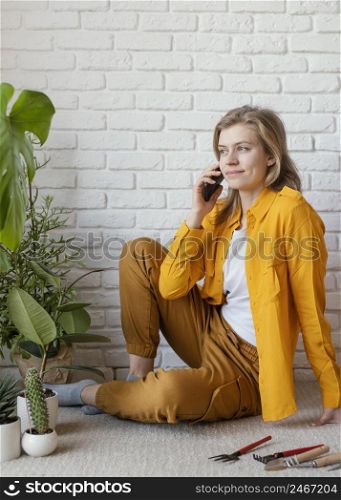young woman talking phone her plant 2