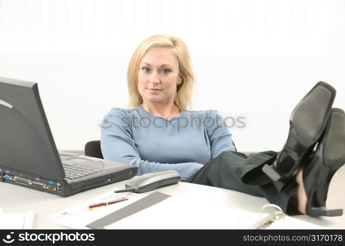 Young Woman Talking Working on Laptop