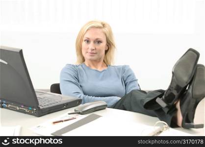 Young Woman Talking Working on Laptop