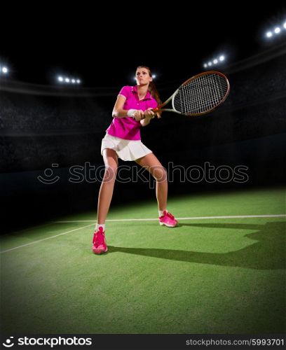 Young woman tennis player at stadium