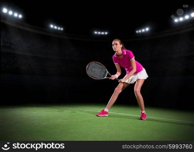 Young woman tennis player at stadium