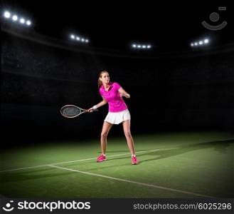 Young woman tennis player on court
