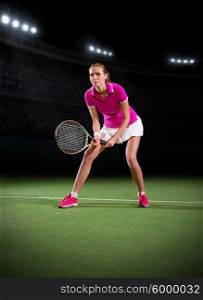 Young woman tennis player on stadium