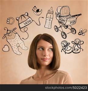 Young woman thinking of her pregnancy plans closeup face portrait and sketches overhead