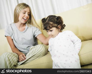 Young woman touching her daughter