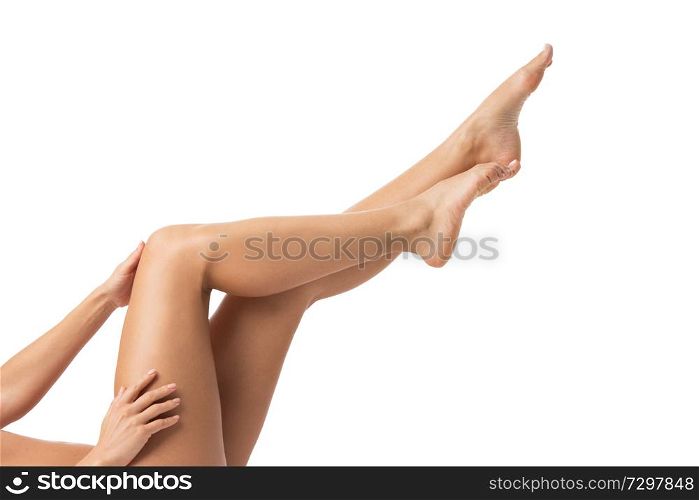 Young woman touching her legs studio isolated on white background. Young woman touching her legs