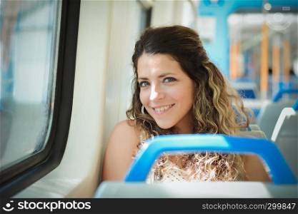 Young woman tourist traveling by the train. Enjoying travel concept.