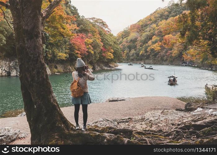 Young woman traveler looking beautiful landscape at arashiyama Japan, Travel lifestyle concept