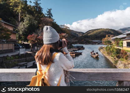 Young woman traveler looking beautiful landscape at arashiyama Japan, Travel lifestyle concept