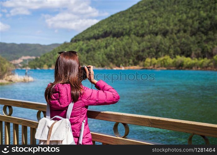 Young woman traveler looking beautiful nature at blue moon valley in China, Travel lifestyle concept