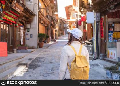 Young woman traveler walking in the old town, Shangri-la, Travel lifestyle concept