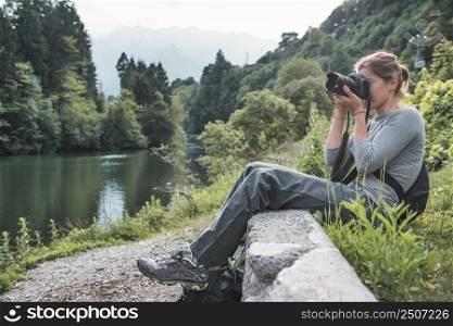Young woman tries her hand at landscape nature photography