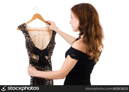 Young woman trying new clothing on white