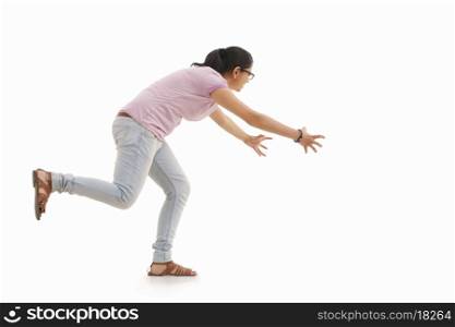 Young woman trying to catch