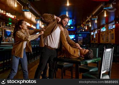 Young woman trying to separate craze mad fighting friends. Conflict of football fans at sport bar. Young woman trying to separate craze mad fighting friends