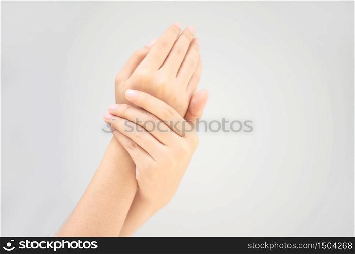Young woman using a hand rub creams