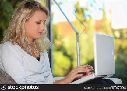 Young woman using a laptop computer indoors