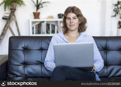 Young woman using her laptop at home. young beautiful woman using a laptop computer at home