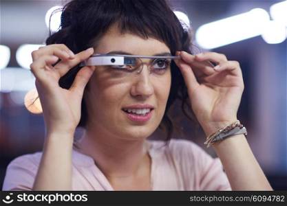 young woman using virtual reality gadget computer technology glasses