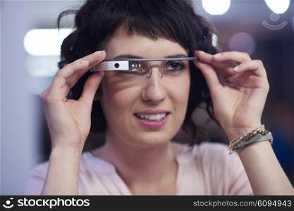 young woman using virtual reality gadget computer technology glasses