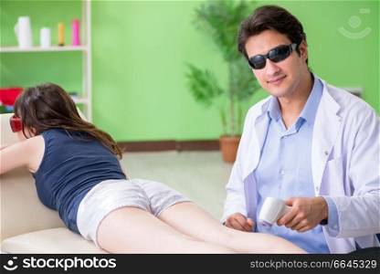 Young woman visiting doctor dermatologist 