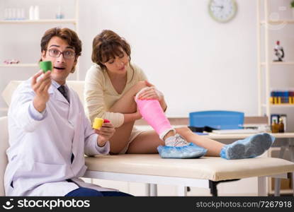 Young woman visiting doctor traumatologist  . Young woman visiting doctor traumatologist 