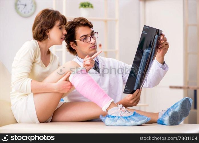 Young woman visiting doctor traumatologist  . Young woman visiting doctor traumatologist 