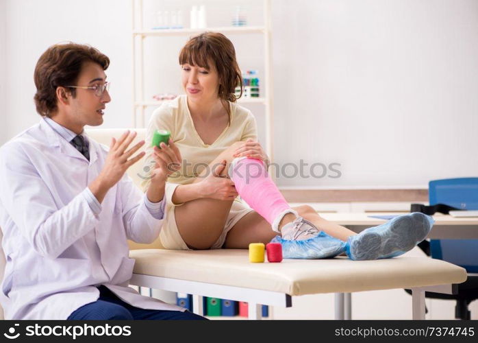 Young woman visiting doctor traumatologist  . Young woman visiting doctor traumatologist 